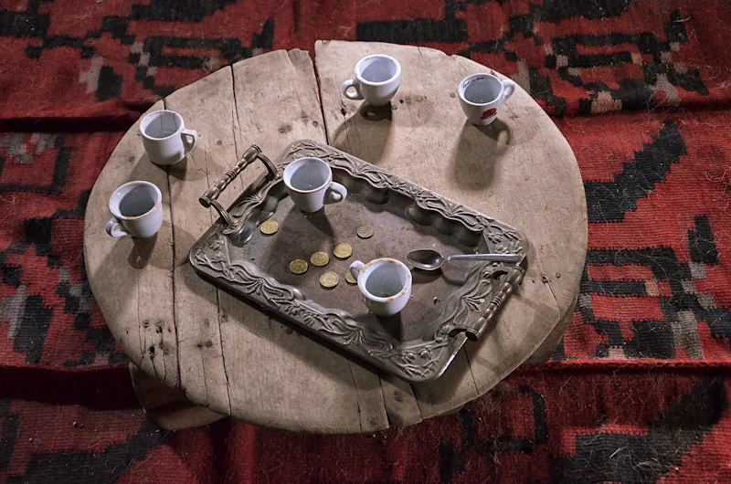 Photo of coffee cups on an old traditional table