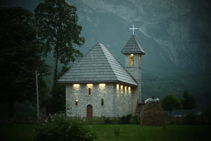 Photo of Theth Church in the evening